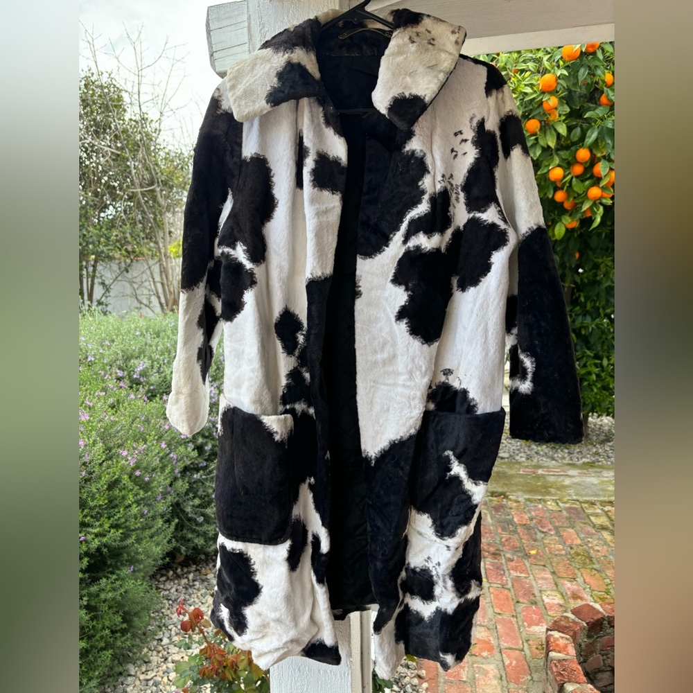 retro-chic style with our cow-printed vintage jackets, with luxurious faux fur